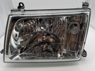 Optique avant gauche réglage électrique Toyota HDJ100 98-07